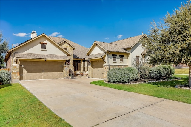 view of front of house with a front lawn and a garage