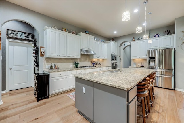 7618 Turnback Ledge Trl, Lago Vista, TX 78645 - kitchen with appliances with stainless steel finishes, a sink, light wood-style flooring, backsplash, and recessed lighting