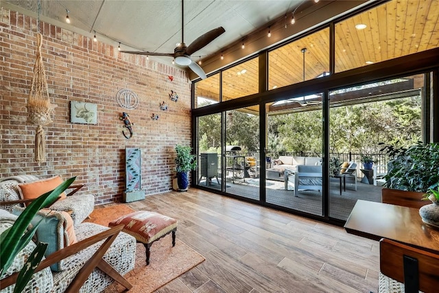 7618 Turnback Ledge Trl, Lago Vista, TX 78645 - sunroom with rail lighting, healthy amount of natural light, outdoor lounge area, and a ceiling fan