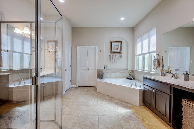 bathroom featuring vanity, separate shower and tub, and tile patterned flooring