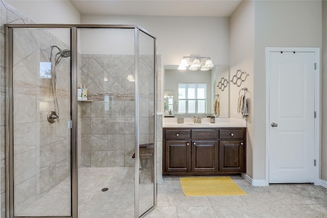 7618 Turnback Ledge Trl, Lago Vista, TX 78645 - bathroom featuring a shower stall, vanity, baseboards, and tile patterned flooring