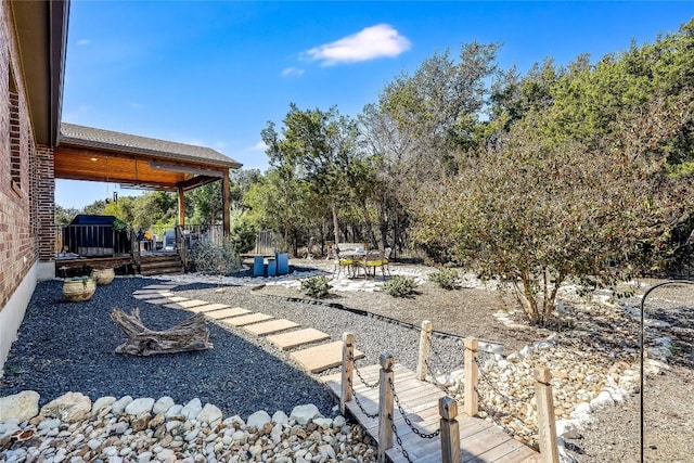 7618 Turnback Ledge Trl, Lago Vista, TX 78645 - view of yard with a patio and a wooden deck