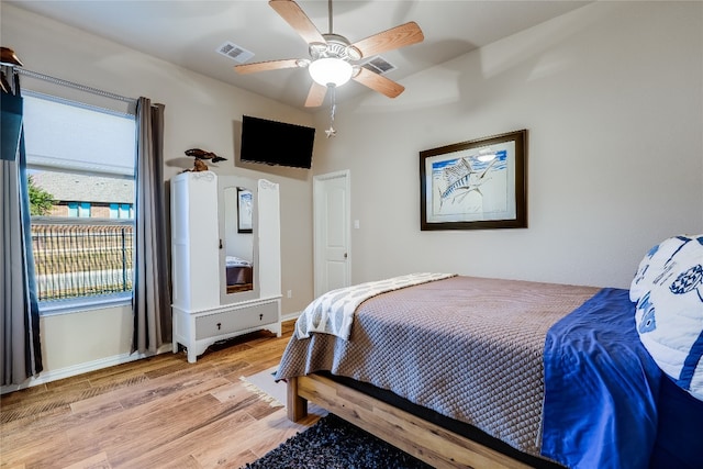 bedroom featuring ceiling fan and light hardwood / wood-style flooring