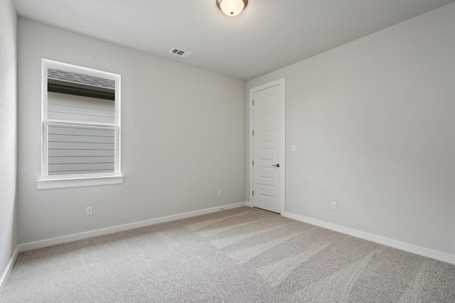 unfurnished room featuring carpet flooring