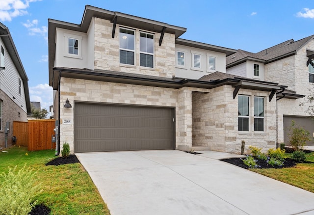 view of front of home with a front lawn and a garage