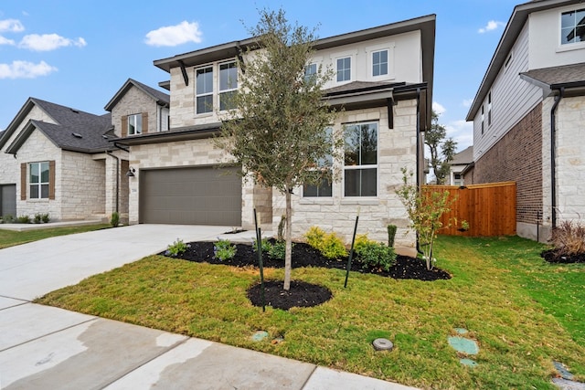 view of front facade with a front yard and a garage