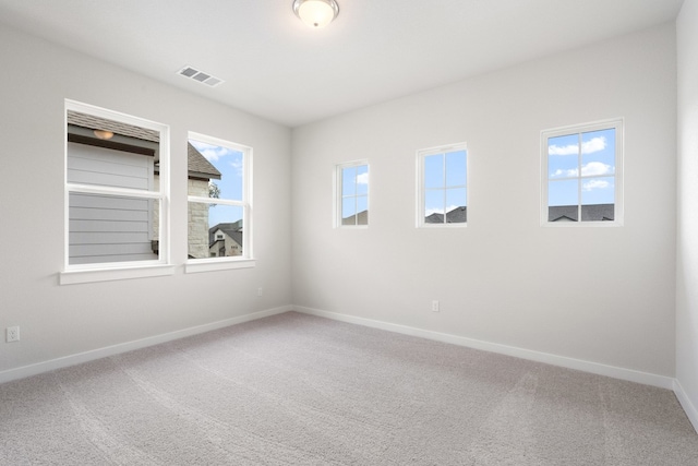 unfurnished room with carpet flooring