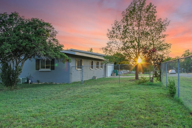 yard at dusk with cooling unit