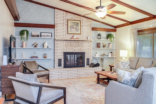 living room featuring ceiling fan, hardwood / wood-style flooring, built in features, a fireplace, and lofted ceiling with beams