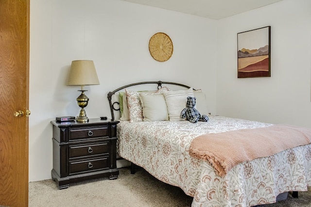 bedroom with light colored carpet