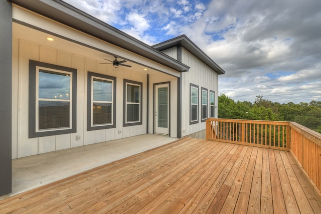 wooden terrace featuring ceiling fan