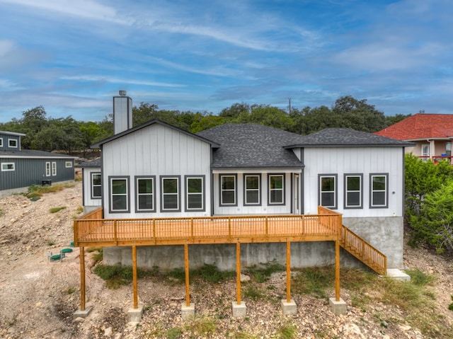 back of house featuring a wooden deck