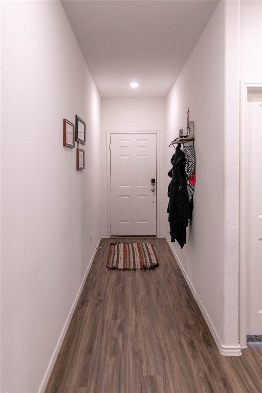 corridor with dark wood-type flooring