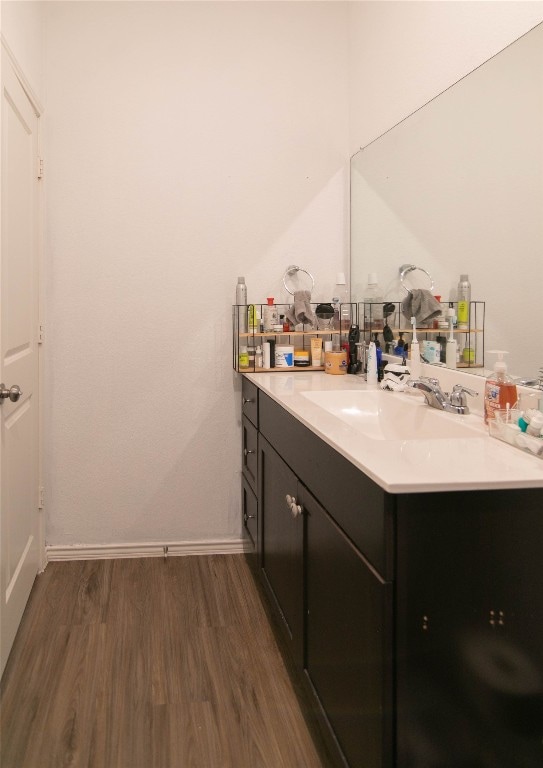 bathroom featuring vanity and hardwood / wood-style floors