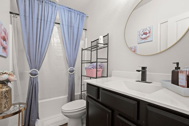 full bathroom featuring vanity, shower / bath combo with shower curtain, and toilet