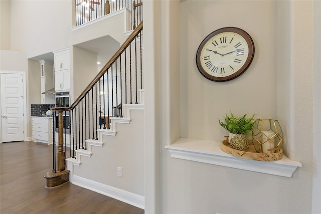 staircase featuring wood-type flooring