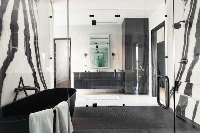 300 Stonewall Ln, Austin, TX 78746 - bathroom with a freestanding bath, vanity, and a stall shower