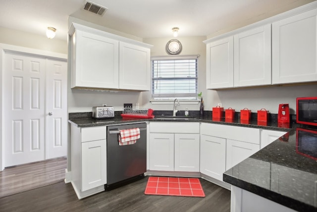 kitchen with stainless steel dishwasher, dark hardwood / wood-style floors, white cabinets, and sink