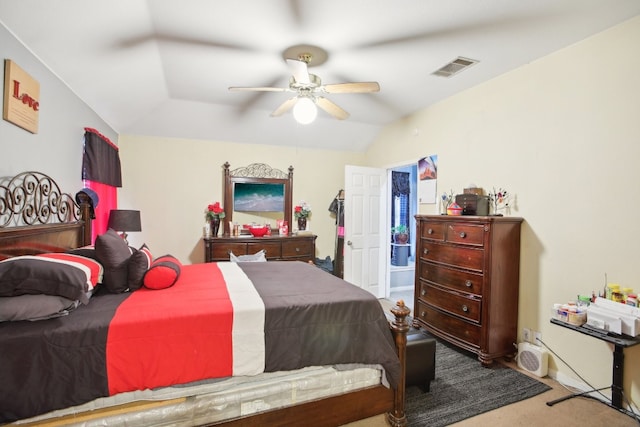 carpeted bedroom featuring ceiling fan and vaulted ceiling