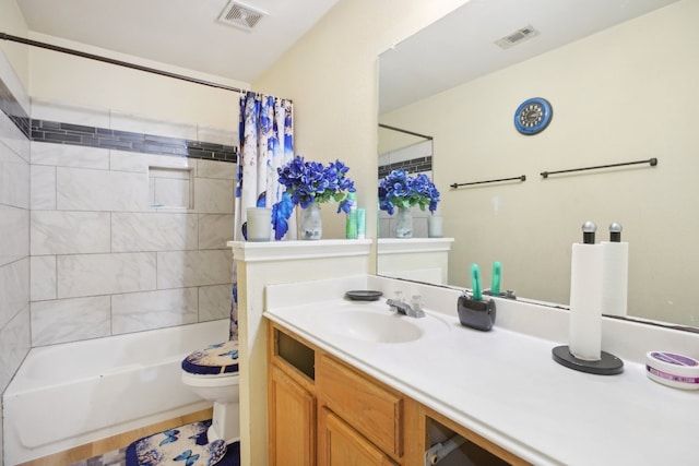 full bathroom featuring shower / bathtub combination with curtain, vanity, and toilet