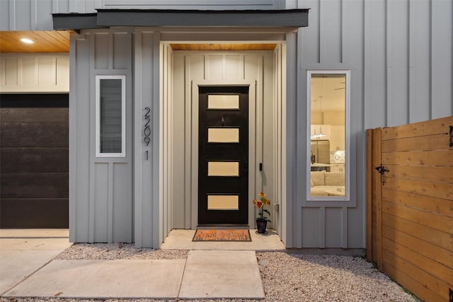 view of exterior entry featuring board and batten siding