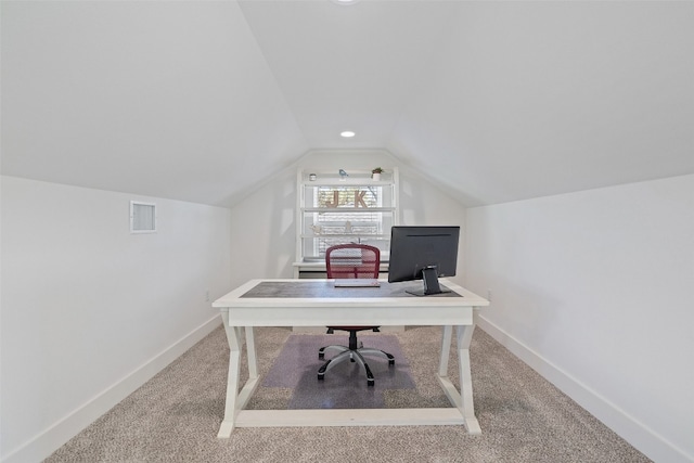 office area with visible vents, lofted ceiling, baseboards, and carpet flooring