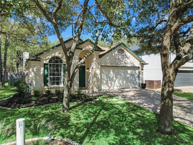 ranch-style home featuring a front yard and a garage