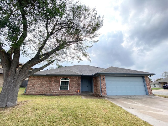 single story home featuring a garage and a front lawn