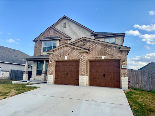 view of front facade featuring a front lawn and a garage