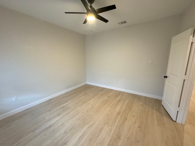 spare room featuring ceiling fan and light hardwood / wood-style flooring