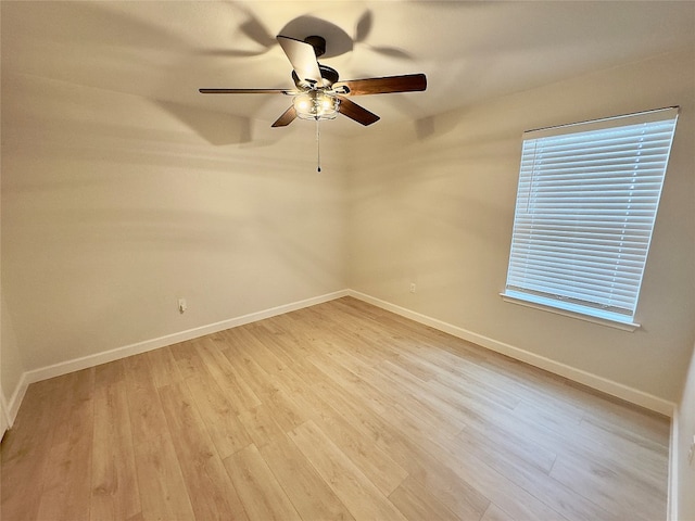 spare room with ceiling fan and light hardwood / wood-style floors