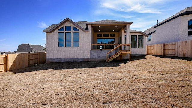920 Teakmill Trl, San Marcos, TX 78666 - back of house with a fenced backyard and brick siding