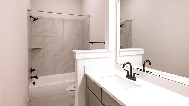 full bathroom featuring bathtub / shower combination, vanity, toilet, and tile patterned floors