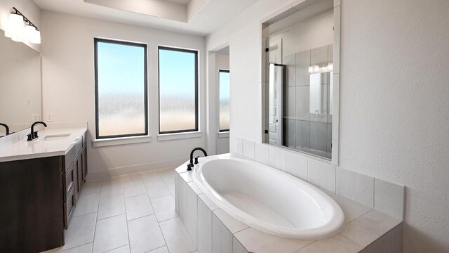 bathroom featuring vanity, a stall shower, a garden tub, and a wealth of natural light