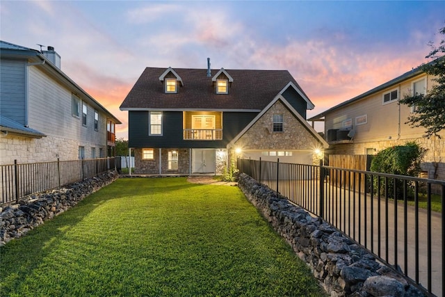 back house at dusk with a yard