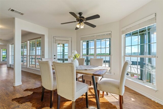 dining space featuring ceiling fan and wood-type flooring