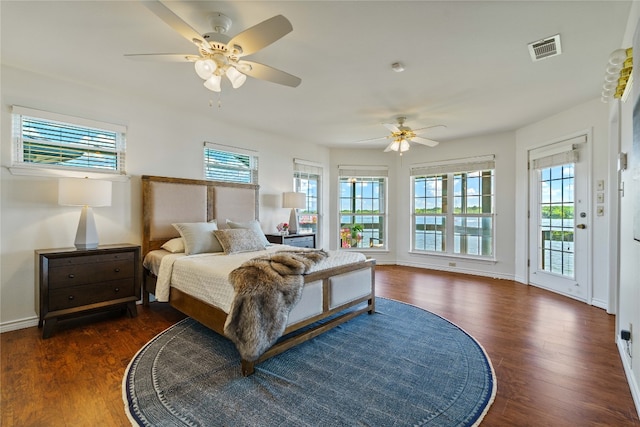 bedroom with ceiling fan, dark hardwood / wood-style flooring, and access to outside