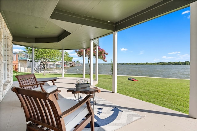 view of patio with a water view