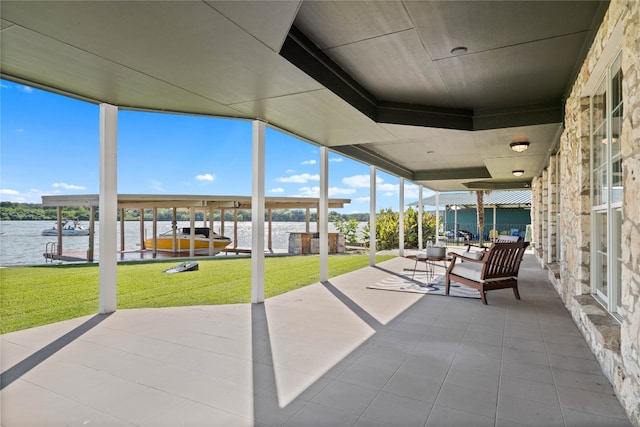 unfurnished sunroom featuring a water view