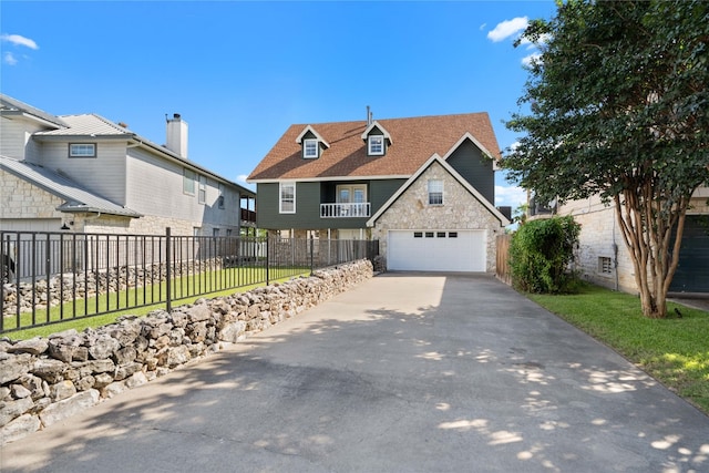 view of front of property with a garage and a front lawn