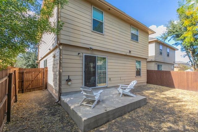 back of property featuring a patio