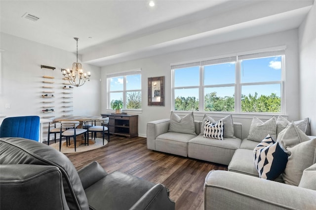 living area with recessed lighting, an inviting chandelier, wood finished floors, visible vents, and baseboards