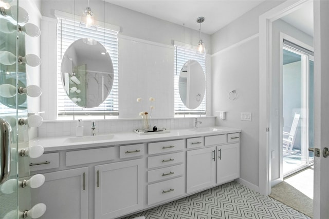 bathroom with vanity and backsplash