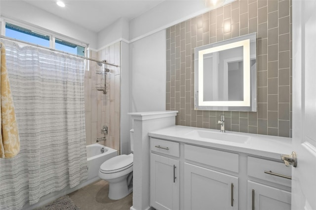 full bathroom featuring vanity, shower / bath combo with shower curtain, toilet, and tile patterned floors