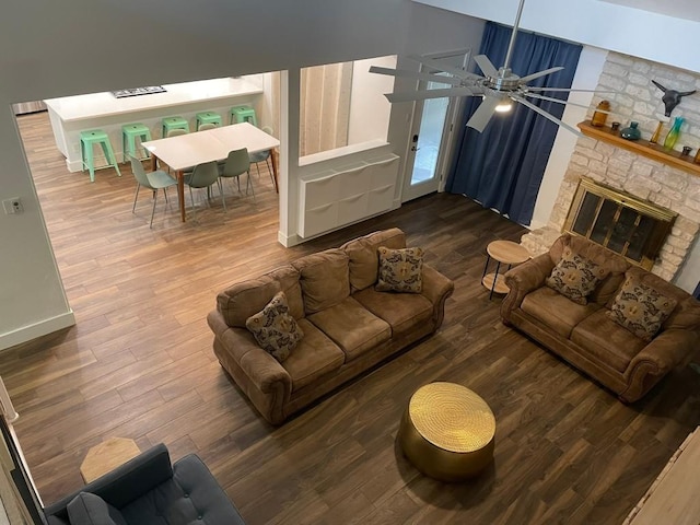 12404 Sceptre Cv, Austin, TX 78727 - living room with wood finished floors, a ceiling fan, and a fireplace