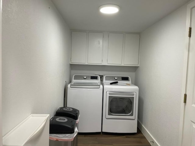 12404 Sceptre Cv, Austin, TX 78727 - laundry area with cabinet space, washer and clothes dryer, and dark wood-type flooring