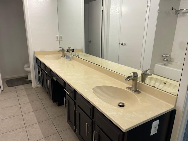 12404 Sceptre Cv, Austin, TX 78727 - bathroom featuring double vanity, tile patterned floors, and washtub / shower combination