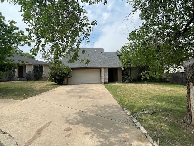12404 Sceptre Cv, Austin, TX 78727 - view of front of property featuring a garage, driveway, a shingled roof, and brick siding