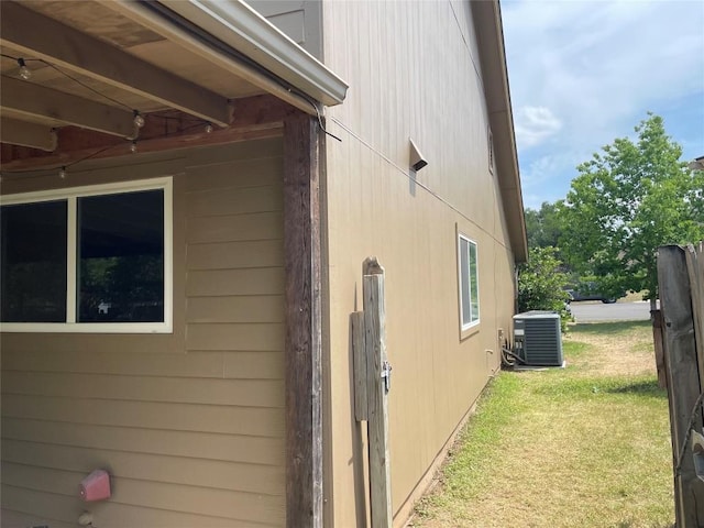 12404 Sceptre Cv, Austin, TX 78727 - view of home's exterior with a central AC unit and a yard