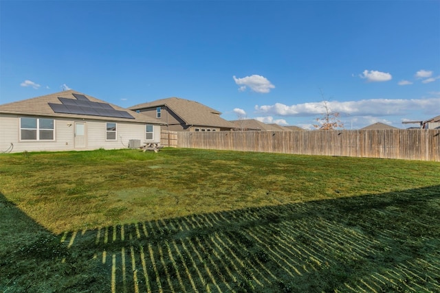 view of yard with central AC